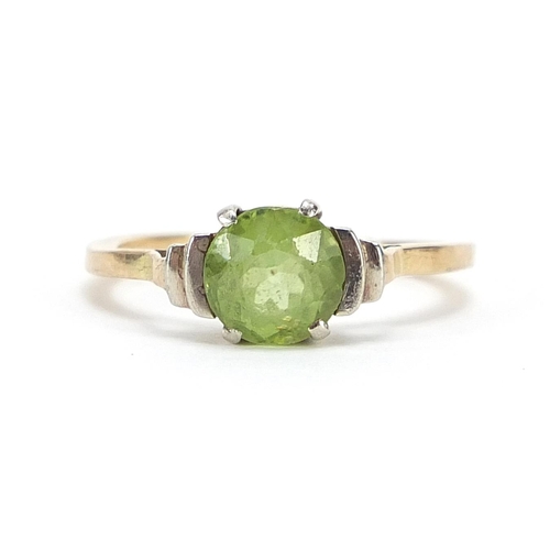 318 - Unmarked gold green stone solitaire ring, possibly peridot, size K, 2.2g