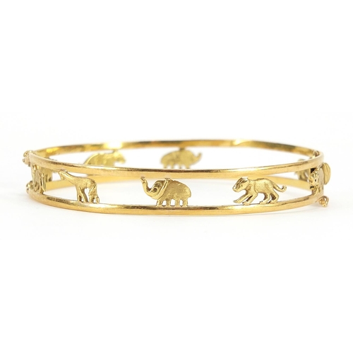 20 - 18ct gold hinged bangle pierced with animals including lion, giraffe, elephant and rhino, housed in ... 