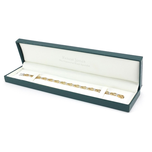 132 - 9ct gold diamond bracelet housed in an Ernest Jones box, stamped 0.15, 18cm in length, 7.7g