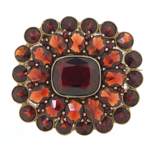 147 - Gilt metal three tier Bohemian garnet cluster brooch, 3.1cm wide, 10.4g