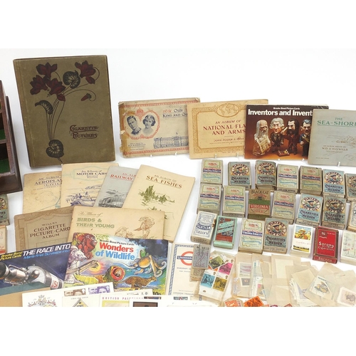 1986 - Large collection of cigarette cards, Barratts Hologrem cards and world stamps, some in boxes and alb... 