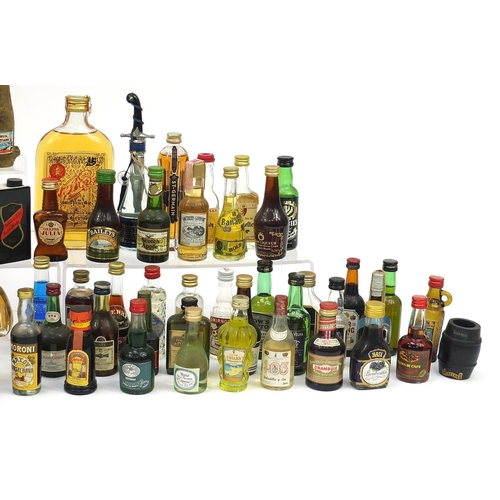 1981 - Large collection of alcohol miniatures and larger bottles of alcohol including Smirnoff vodka, Beefe... 