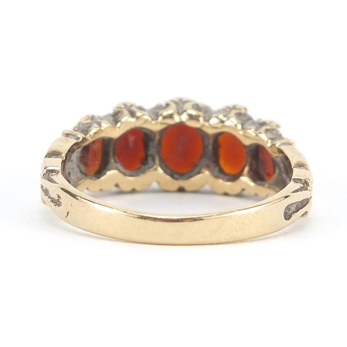 88 - 9ct gold garnet five stone ring, size O, 3.4g