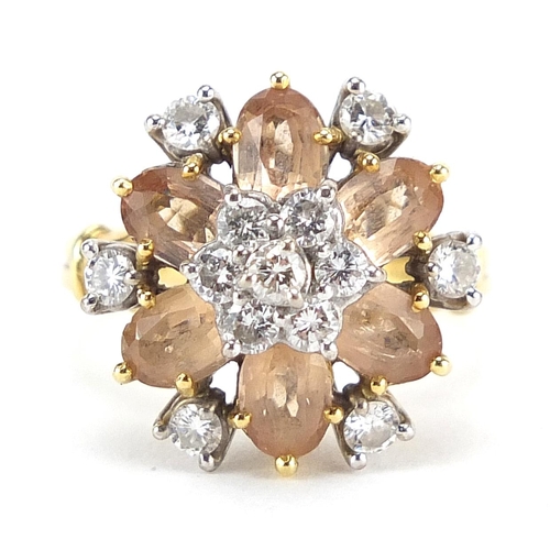 65 - 18ct gold diamond and topaz cluster ring, size M, 7.3g