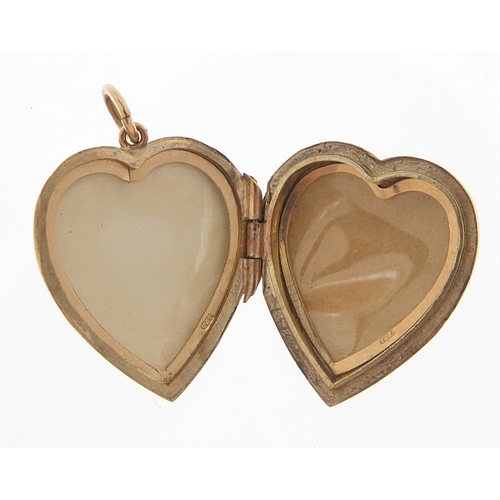 288 - 9ct gold love heart locket with engraved decoration, 2.2cm high, 3.8g