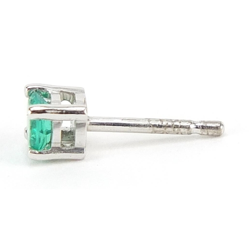 228 - Pair of 18ct white gold emerald stud earrings, 5mm in diameter, 1.6g