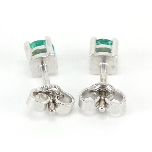 228 - Pair of 18ct white gold emerald stud earrings, 5mm in diameter, 1.6g