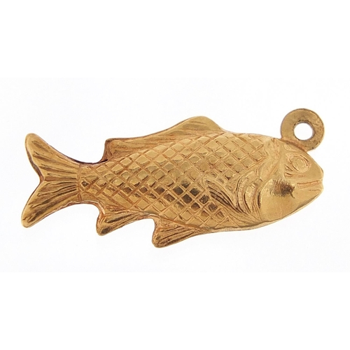 217 - 18ct gold fish charm, 2.2cm in length, 2.0g