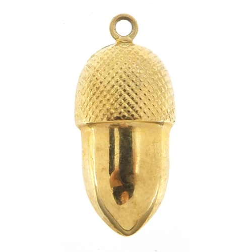 239 - Unmarked gold acorn charm, (tests as 9ct gold) 2.4cm high, 1.2g