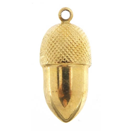 239 - Unmarked gold acorn charm, (tests as 9ct gold) 2.4cm high, 1.2g