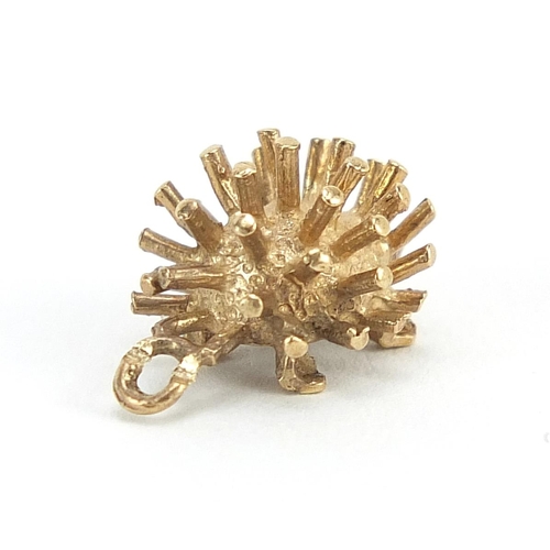 233 - Unmarked gold hedgehog charm, (tests as 9ct gold) 1.2cm in length, 1.0g