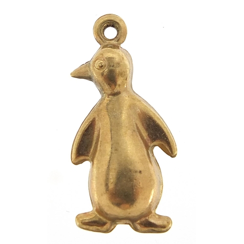 241 - Unmarked gold penguin charm, (tests as 9ct gold) 2.2cm high, 1.2g