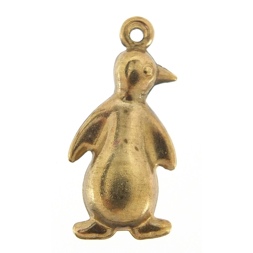 241 - Unmarked gold penguin charm, (tests as 9ct gold) 2.2cm high, 1.2g