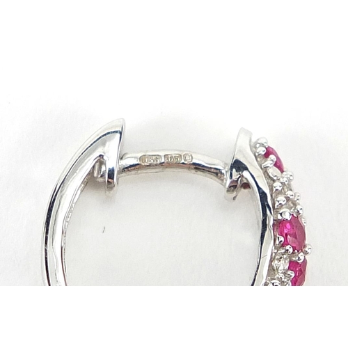 125 - Pair of 9ct white gold ruby and diamond hoop earrings, 1.2cm in diameter, 2.9g