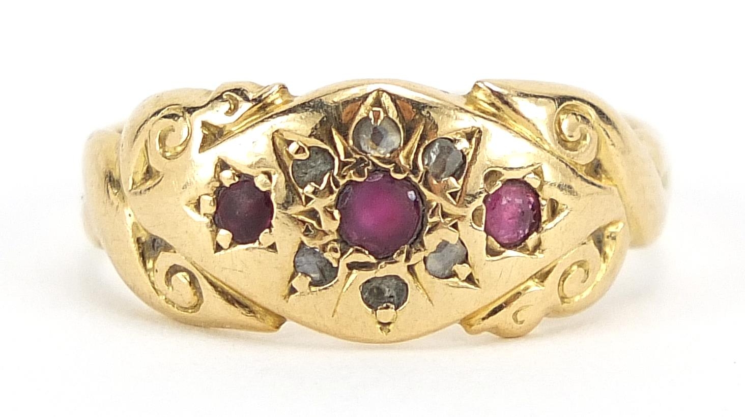Antique 18ct gold ruby and diamond ring with scrolled shoulders