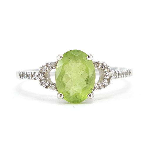 123 - 9ct white gold peridot and diamond ring, size O, 1.9g