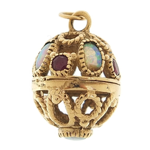 81 - 9ct gold opal and ruby pierced egg pendant, 2.5cm high, 6.8g