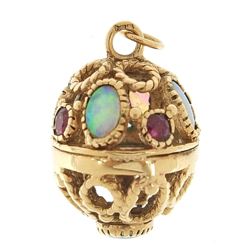 81 - 9ct gold opal and ruby pierced egg pendant, 2.5cm high, 6.8g