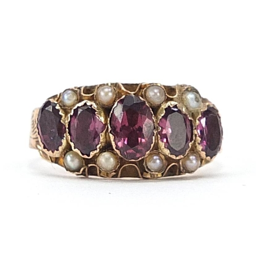 67 - Antique 9ct gold garnet and seed pearl ring with pierced setting and engraved band, Chester 1915, si... 