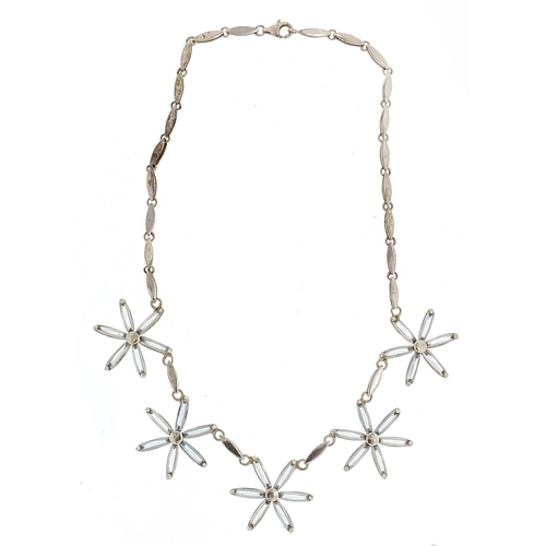 253 - Modernist silver flower head necklace set with blue stones, 40cm in length, 26.2g