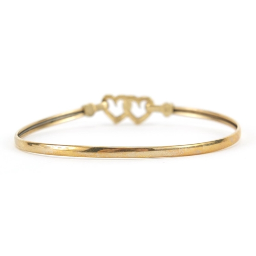 48 - 9ct gold love heart bangle, 5.9cm wide, 4.7g
