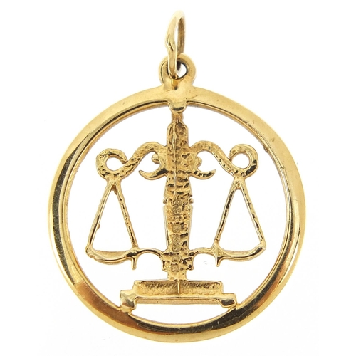 230 - 9ct gold weighing scales pendant, 2.3cm high, 1.7g