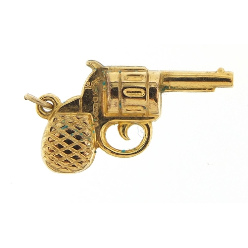 298 - 9ct gold revolver charm, 2.5cm wide, 1.0g