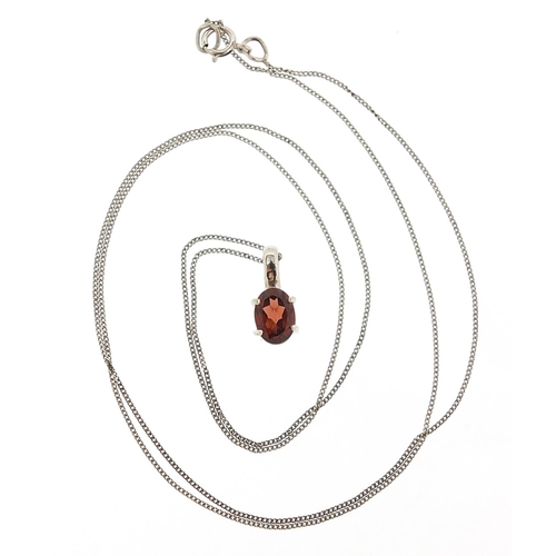 242 - Unmarked white metal red stone pendant on a 9ct white gold necklace, 1.3cm high and 48cm in length, ... 