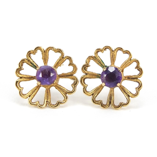 69 - Pair of unmarked gold purple stone flower head stud earrings, 1.3cm in diameter, 1.5g