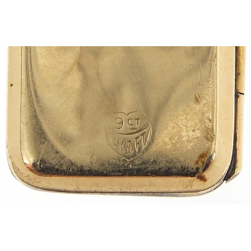 265 - 9ct gold back and front locket with engine turned decoration, 2.5cm high, 5.4g