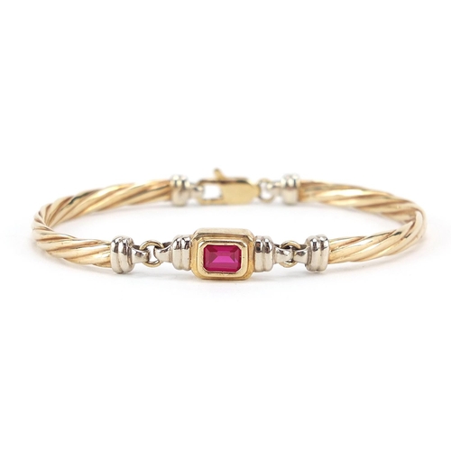 120 - 9ct gold ruby bracelet, 6.3cm wide, 11.3g