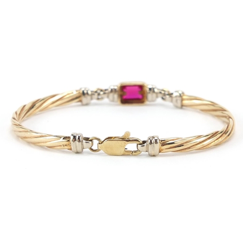 120 - 9ct gold ruby bracelet, 6.3cm wide, 11.3g