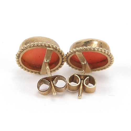 273 - Pair of 9ct gold cabochon coral stud earrings, 1.1cm high, 2.0g