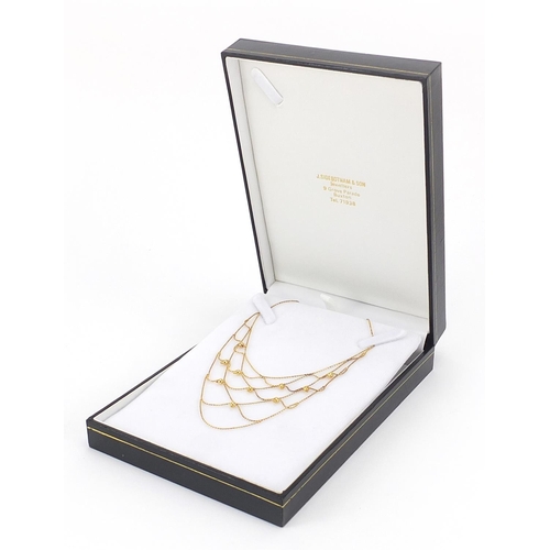 202 - 9ct gold flapper style necklace housed in a J Sidebotham & Son Buxton box, 40cm in length, 3.8g