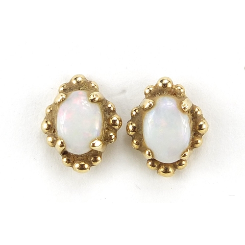 29 - Pair of 9ct gold cabochon opal stud earrings, 1.1cm high, 1.7g