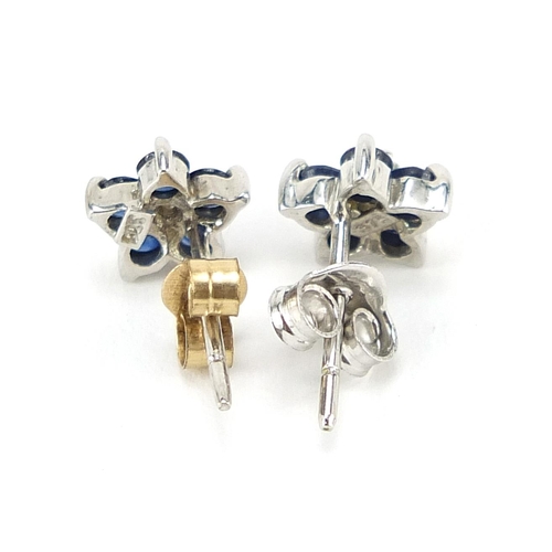 232 - Pair of 9ct white gold diamond and sapphire flower head stud earrings, 6mm in diameter, 0.8g