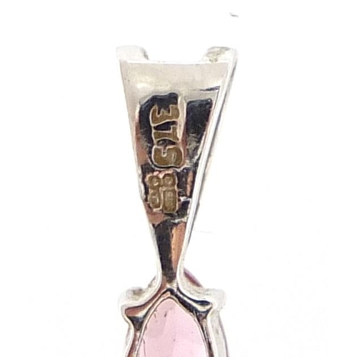 122 - 9ct white gold pink stone cross pendant, 2.5cm high, 1.1g