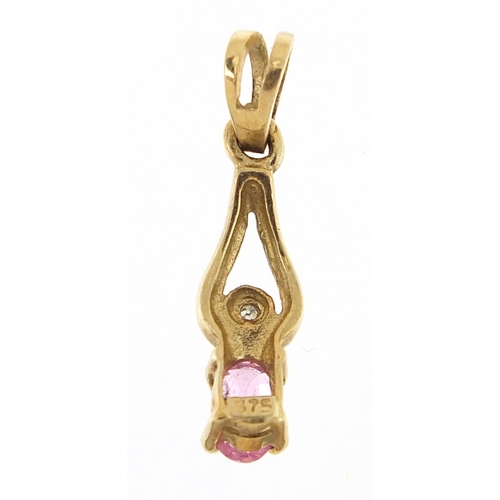 319 - 9ct gold ruby and diamond, 1.8cm high, 0.6g