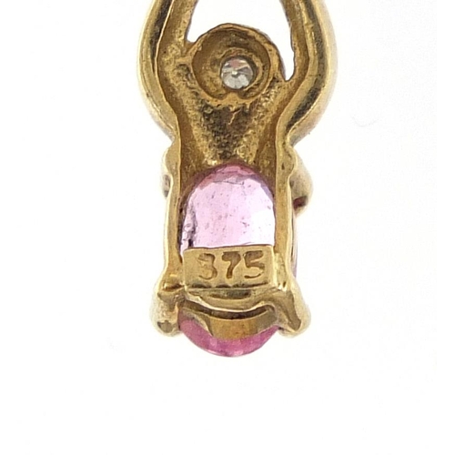 319 - 9ct gold ruby and diamond, 1.8cm high, 0.6g