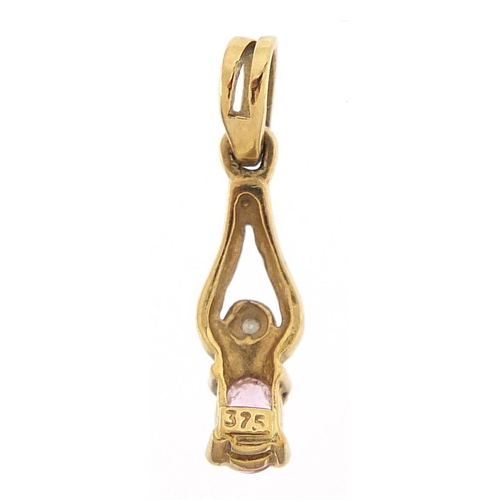 356 - 9ct gold pink sapphire and diamond pendant, 1.8cm high, 0.6g