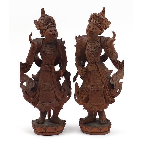 2000 - Pair of Balinese hardwood carvings of goddesses, the largest 58cm high