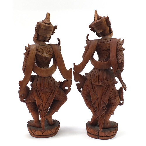 2000 - Pair of Balinese hardwood carvings of goddesses, the largest 58cm high