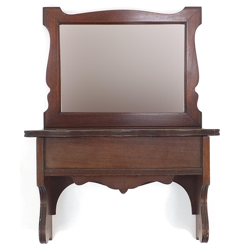 1494 - Edwardian mahogany wall mirror with bevelled glass above compartment, 66cm high x 44.5cm wide