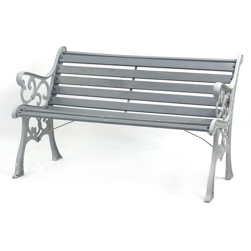 1496 - Painted cast iron and wooden slat garden bench, 129cm in length