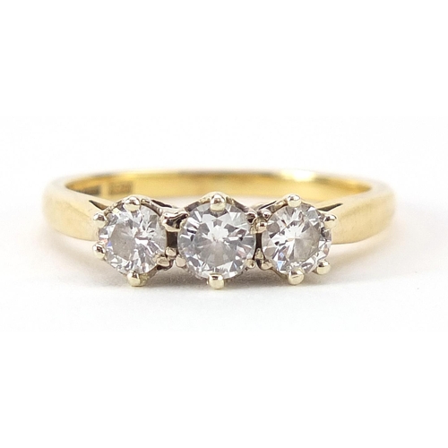 292 - 18ct gold diamond three stone ring, total diamond weight approximately 0.51ct, size J, 2.6g