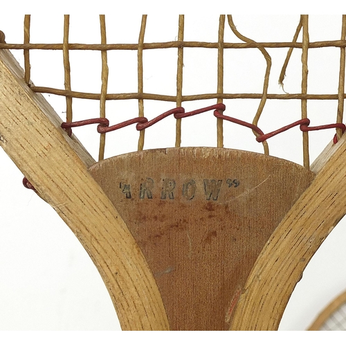 1996 - Three early 20th century lawn tennis racquets including Arrow, the largest 66cm in length