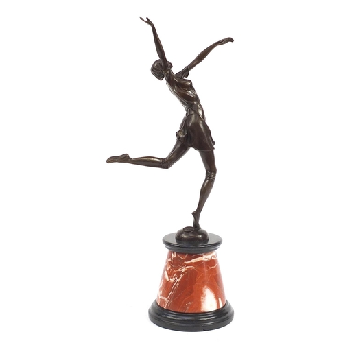 1215 - Large patinated bronze figurine of an Art Deco dancer raised on a tapering marble and black slate ba... 