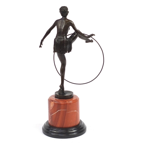 603 - Large patinated bronze figurine of an Art Deco dancer raised on a marble and black slate base, 48cm ... 