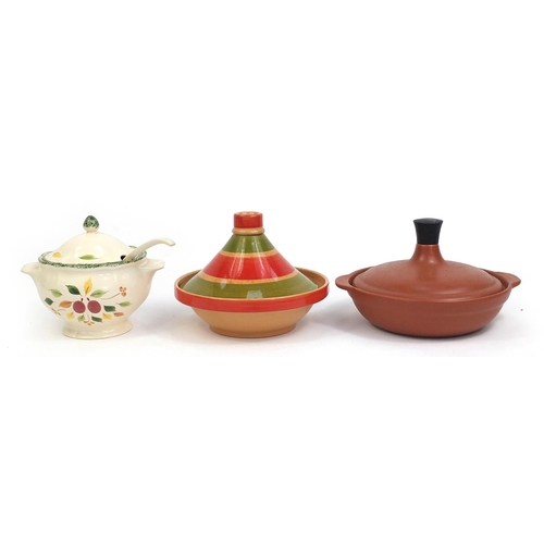 116 - Two pottery tagines and a floral pottery soup bowl with ladle and cover, the largest 25cm high