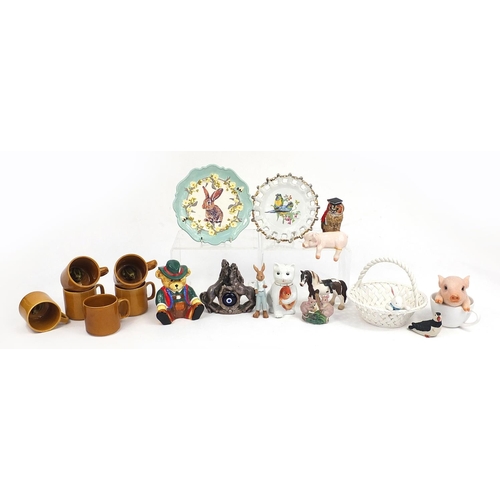 93 - Animal related ceramics and statues including teddy money box, rabbit plate, rabbit basket, cat teap... 